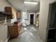 Kitchen features a sink, cabinets, and a window, presenting an opportunity for a renovation at 1314 Laurel St, Indianapolis, IN 46203