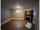 Living room featuring gray walls, hardwood floors, and a decorative fireplace, ready for renovation at 1314 Laurel St, Indianapolis, IN 46203