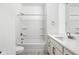 Bright bathroom featuring a shower-tub combination, white cabinetry, and modern fixtures at 1322 Colere Pl, Indianapolis, IN 46203