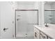 Modern bathroom with a glass-enclosed shower featuring subway tile and brushed nickel hardware at 1322 Colere Pl, Indianapolis, IN 46203