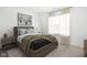 Comfortable bedroom with a large window, stylish decor, and a cozy bed with decorative pillows at 1322 Colere Pl, Indianapolis, IN 46203