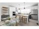 Elegant kitchen with a center island, stainless steel appliances, and a dining area at 1322 Colere Pl, Indianapolis, IN 46203