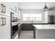 Stylish kitchen featuring an island, stainless steel appliances, and modern cabinetry at 1322 Colere Pl, Indianapolis, IN 46203