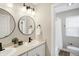 Bright bathroom featuring double sink vanity with modern faucet fixtures and dual mirror at 1429 Deloss St, Indianapolis, IN 46201