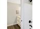 Bright bathroom featuring a white shower tub and white vanity with modern faucet fixtures at 1429 Deloss St, Indianapolis, IN 46201