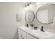 Bright bathroom featuring double sink vanity with modern faucet fixtures and dual mirror at 1429 Deloss St, Indianapolis, IN 46201