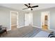 Spacious bedroom showcasing neutral walls, carpet floors, and an open closet and entryway at 1429 Deloss St, Indianapolis, IN 46201