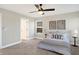 Bedroom featuring a ceiling fan, two pieces of artwork, and a window with natural light at 1429 Deloss St, Indianapolis, IN 46201