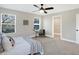 Bedroom featuring large windows, ceiling fan and adjacent closet at 1429 Deloss St, Indianapolis, IN 46201