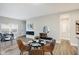 Open-concept living space with modern dining table and chairs next to an elegant fireplace at 1429 Deloss St, Indianapolis, IN 46201