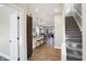 Open-concept interior with staircase, kitchen island, and living room at 1429 Deloss St, Indianapolis, IN 46201