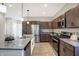 Modern kitchen with granite countertops, stainless steel appliances, and an island at 1429 Deloss St, Indianapolis, IN 46201