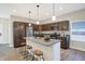 Open kitchen with granite countertops, an island, wood cabinets and stainless appliances at 1429 Deloss St, Indianapolis, IN 46201