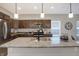 Well-equipped kitchen with stainless steel appliances, granite countertops, and stylish pendant lighting at 1429 Deloss St, Indianapolis, IN 46201