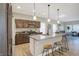Modern kitchen with granite countertops, wood cabinets, and stainless steel appliances at 1429 Deloss St, Indianapolis, IN 46201