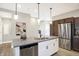 Modern kitchen with granite island, pendant lighting, and stainless steel appliances at 1429 Deloss St, Indianapolis, IN 46201