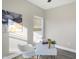 Home office features a modern desk, wood-style flooring, and natural light at 1429 Deloss St, Indianapolis, IN 46201