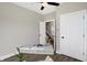 Home office features a modern desk, open doorway, and wood-style flooring at 1429 Deloss St, Indianapolis, IN 46201
