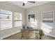 Bright office features a modern desk, multiple windows, and wood-style flooring at 1429 Deloss St, Indianapolis, IN 46201