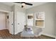Bright office features a modern desk, ceiling fan, and wood-style flooring at 1429 Deloss St, Indianapolis, IN 46201