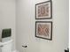 Simple powder room featuring a modern toilet and decorative art at 1429 Deloss St, Indianapolis, IN 46201