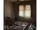Bedroom with natural light and original features, ready to be transformed into a cozy retreat at 155 S Elder Ave, Indianapolis, IN 46222