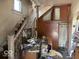 Entryway featuring a staircase with wood trim, and built-in storage solutions to enhance functionality at 155 S Elder Ave, Indianapolis, IN 46222