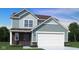 Inviting two-story home with a two-car garage, attractive siding, and a well-maintained lawn at 1577 Vision Ct, Danville, IN 46122