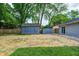 Backyard featuring two storage sheds with ample space for gardening and lawn care equipment at 1604 Stacy Lynn Dr, Indianapolis, IN 46231
