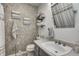 Charming bathroom features a decorative textured wall, neutral color palette, and well-organized towel storage at 1604 Stacy Lynn Dr, Indianapolis, IN 46231