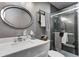 Bathroom featuring a marble countertop, modern sink, and glass-enclosed shower, designed with contemporary style at 1604 Stacy Lynn Dr, Indianapolis, IN 46231