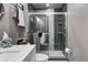 Modern bathroom with a glass-enclosed shower, marble vanity, and neutral color palette creating a spa-like retreat at 1604 Stacy Lynn Dr, Indianapolis, IN 46231