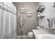 Relaxing bathroom with a textured accent wall, organized towel rack, and neutral decor for a serene atmosphere at 1604 Stacy Lynn Dr, Indianapolis, IN 46231