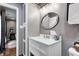 Bathroom featuring a modern vanity, framed mirror, and ample lighting, creating a clean and inviting space at 1604 Stacy Lynn Dr, Indianapolis, IN 46231