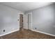 Cozy bedroom with wood-look floors offers ample space, with an adjoining closet and natural light at 1604 Stacy Lynn Dr, Indianapolis, IN 46231