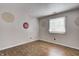 Minimalist bedroom featuring hardwood flooring and a window, offering a serene and uncluttered space at 1604 Stacy Lynn Dr, Indianapolis, IN 46231