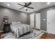 Bedroom with overhead lighting, a ceiling fan, and closet doors offering ample storage space at 1604 Stacy Lynn Dr, Indianapolis, IN 46231