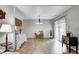 Open dining area with wood flooring, chandelier lighting, and sliding glass doors offering natural light at 1604 Stacy Lynn Dr, Indianapolis, IN 46231