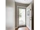 Inviting entryway features new vinyl flooring and lots of natural light coming through the storm door at 1604 Stacy Lynn Dr, Indianapolis, IN 46231