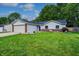 Charming single-story home with a manicured lawn, attached garage, and brick accents at 1604 Stacy Lynn Dr, Indianapolis, IN 46231