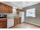 Functional kitchen features wood cabinets, stainless steel sink, and plenty of counter space at 1604 Stacy Lynn Dr, Indianapolis, IN 46231