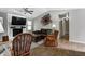 Cozy living room features a white brick fireplace, lots of natural light, and stylish decor at 1604 Stacy Lynn Dr, Indianapolis, IN 46231