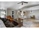 Open-concept living room features vinyl flooring, vaulted ceiling, and comfortable seating area at 1604 Stacy Lynn Dr, Indianapolis, IN 46231