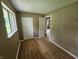 Bedroom featuring hard surface floors, neutral walls, and a large closet at 1614 Dayton Ave, Indianapolis, IN 46203