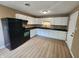 Bright kitchen featuring white cabinets, modern appliances, and a clean, open layout at 1614 Dayton Ave, Indianapolis, IN 46203