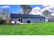 Spacious backyard with a well-maintained lawn and a patio area for outdoor enjoyment at 170 Briar Hill Dr, Whiteland, IN 46184