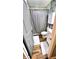 Cozy bathroom featuring a vanity, toilet, and shower with stylish wood-look flooring at 170 Briar Hill Dr, Whiteland, IN 46184