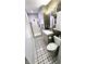 Modern bathroom featuring a glass-enclosed shower and vanity, complemented by stylish tile flooring and lighting at 170 Briar Hill Dr, Whiteland, IN 46184