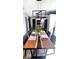 Elegant dining room with a unique wood table and modern lighting fixtures at 170 Briar Hill Dr, Whiteland, IN 46184
