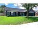 Charming home features a well-manicured lawn, blue siding, and a two-car garage at 170 Briar Hill Dr, Whiteland, IN 46184